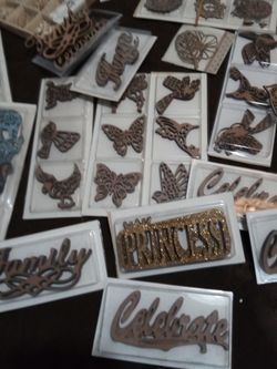 over 26 packages of wood embellishments for arts and craft (All for $12