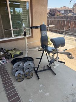 Bench press with 7ft 40lbs bar plus 245lbs of Olympic weights and weight tree