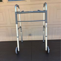 Standard two-button folding adult walker with front wheels