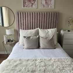 Full Sized Bed With Tall Mauve Headboard
