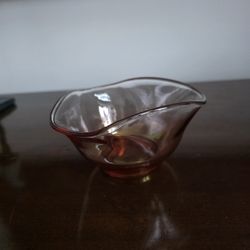 Glass bowl with iridescent amber-pink finish by Indiana Glass Company