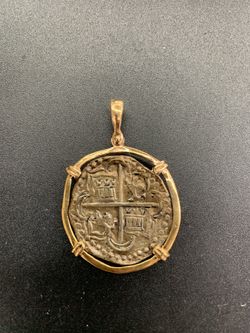 Atocha silver coin pendant in gold bezel