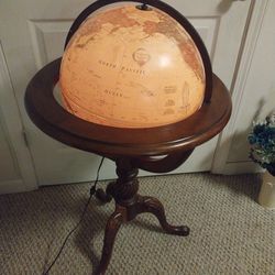 Lighted globe on stand.