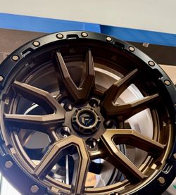 On Sale. Fuel 17x9 5x127 6x139.7 bronze wheels & 35x12.50-17 NITTO or Toyo Mikey Thompson tires (We afinance)