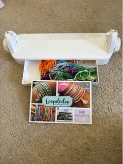 Loopdedoo Spinning Loom Kit designed for making friendship bracelets and other accessories in minutes.