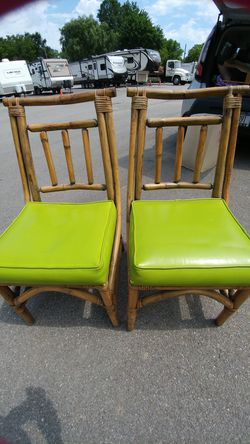 Two beautiful wicker chairs with lime green retro cushions