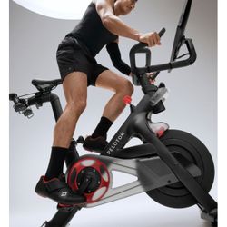 Peloton Bike with 2 pairs shoes , weights, mat and gel  seat cover.