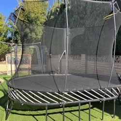 SpringFree Oval trampoline with hoop, excellent condition