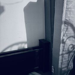 Queen bed with footboard headboard, rails, and mattress, and boxspring