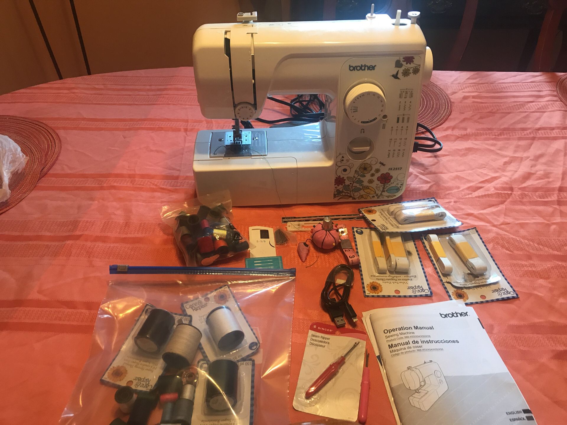 Brother sewing machine used only 2 times: has bobbin winder,thread guide,quick set bobbin,and many other gadgets. Comes with original instruction boo