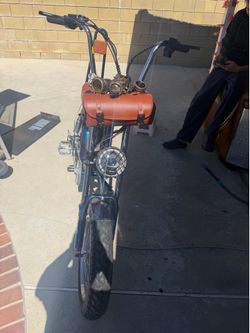 A steampunk-style electric off-road bike—perfect for Burning Man—featuring a 2000W peak power motor and a top speed of 31 mph (approx. 50 km/h). Equip