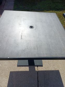 2 outside restaurant table with hole for umbrella $50 each