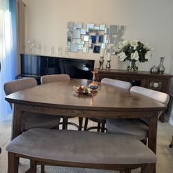 Wooden Dining Table, Rotating Chairs and a buffet
