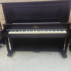 Vintage R.S. Howard Co. upright piano, from the early 20th century.