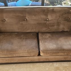 Transitional style sofa in a Brown, with suede fabric. 