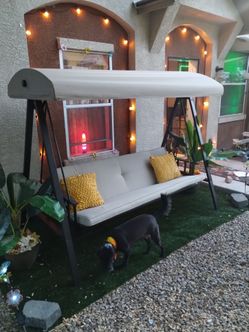 Covered swing lay down into bed