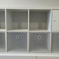 IKEA KALLAX Shelf unit - White  8 open shelves - 1 with a door, 4 with white metal storage boxes 