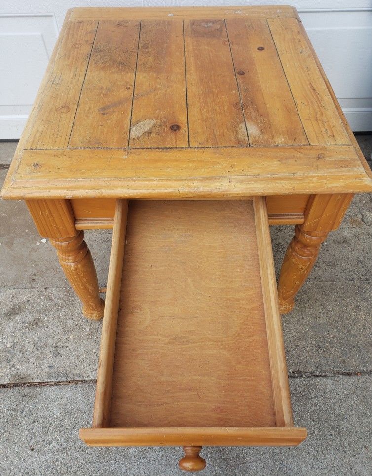 Heavy wood coffee table - 24"w x 27"d x 21”h with deep drawer in the front