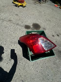 2015 Nissan Sentra driver side rear tail light assembly.