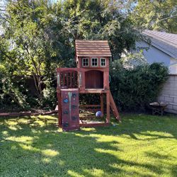 Wooden Play Structure With Climbing Wall