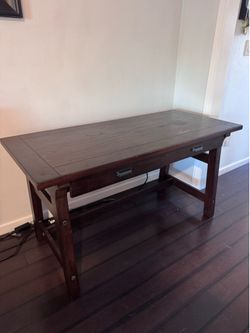 Wood desk with power outlets