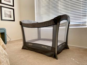 New Graco pack and play portable compact baby play yard and changer in a grey color.
