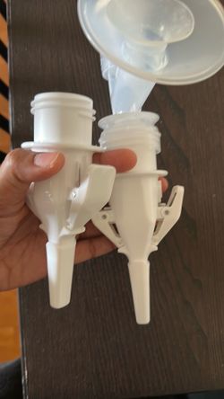Breast pump to breast milk storage bag adapter