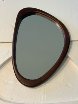 Asymmetrical wall mirror