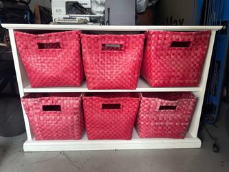 White Pottery Barn Kids Bookcase with red toy baskets