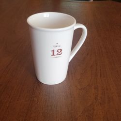 2010 Starbucks Tall 12 Ounces White Ceramic Coffee Mug 12 oz  355 ml . 
Pre-owned, perfect shape, like new. It is 5" tall, weight 13oz plus 
shipping 