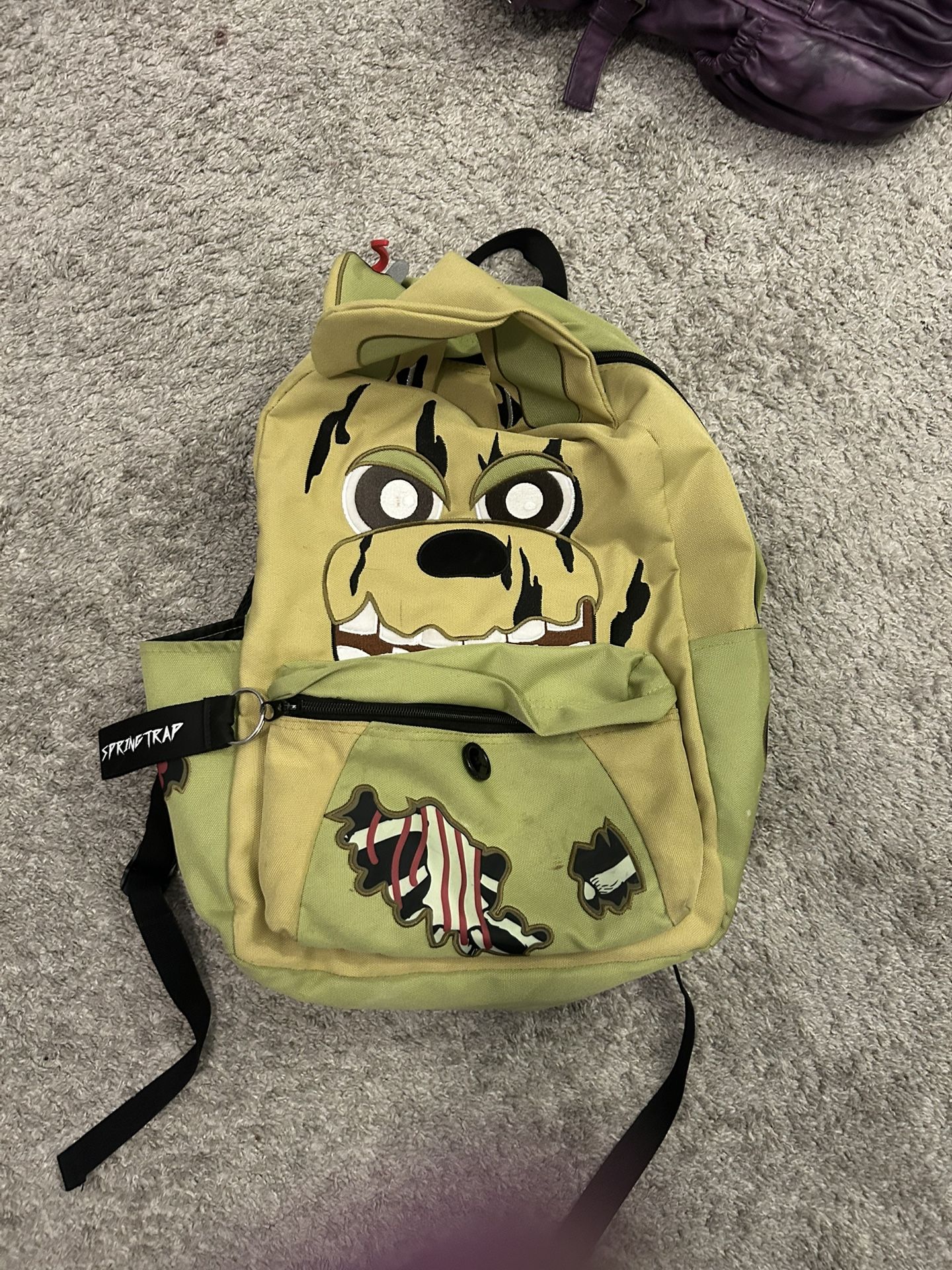 spring trap back pack