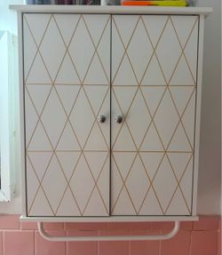 Bathroom cabinet with towel holder