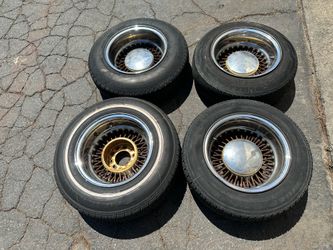 Roadster 5 lug Bolt on 13 inch wire wheels with old tires.