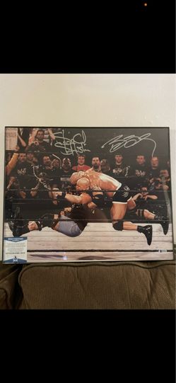 Autographed stone cold and Goldberg with COA