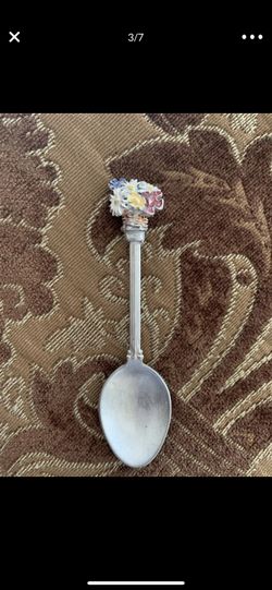 Silver plate teaspoon had bunch of flowers