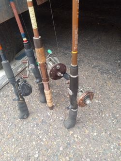 Vintage fishing rods with reels.