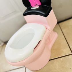 Disney Minnie Mouse potty training toilet. This 2-in-1 system includes a training potty and a removable trainer seat.