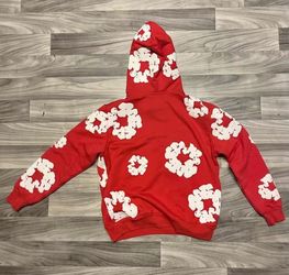 Red denim tears with white flowers