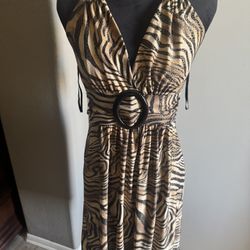 Halter neck dress with tie  back detail leopard print dress. Size M new  The fabric is stretchy  New