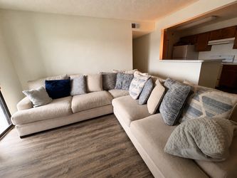 Beige L-shaped couch / sectional for sale