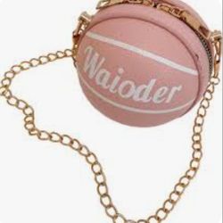 New Waioder Pink Faux Leather Basketball Shaped Crossbody Gold Color Chain Strap. This is a Waioder basketball-shaped purse, a pink crossbody bag with