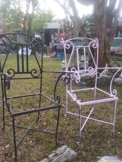 Two heavy solid metal iron chairs