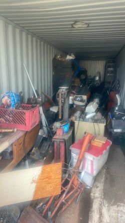 Storage bin full of motorcycles and miscellaneous motorcycle parts Storage bin full of motorcycles and miscellaneous motorcycle parts