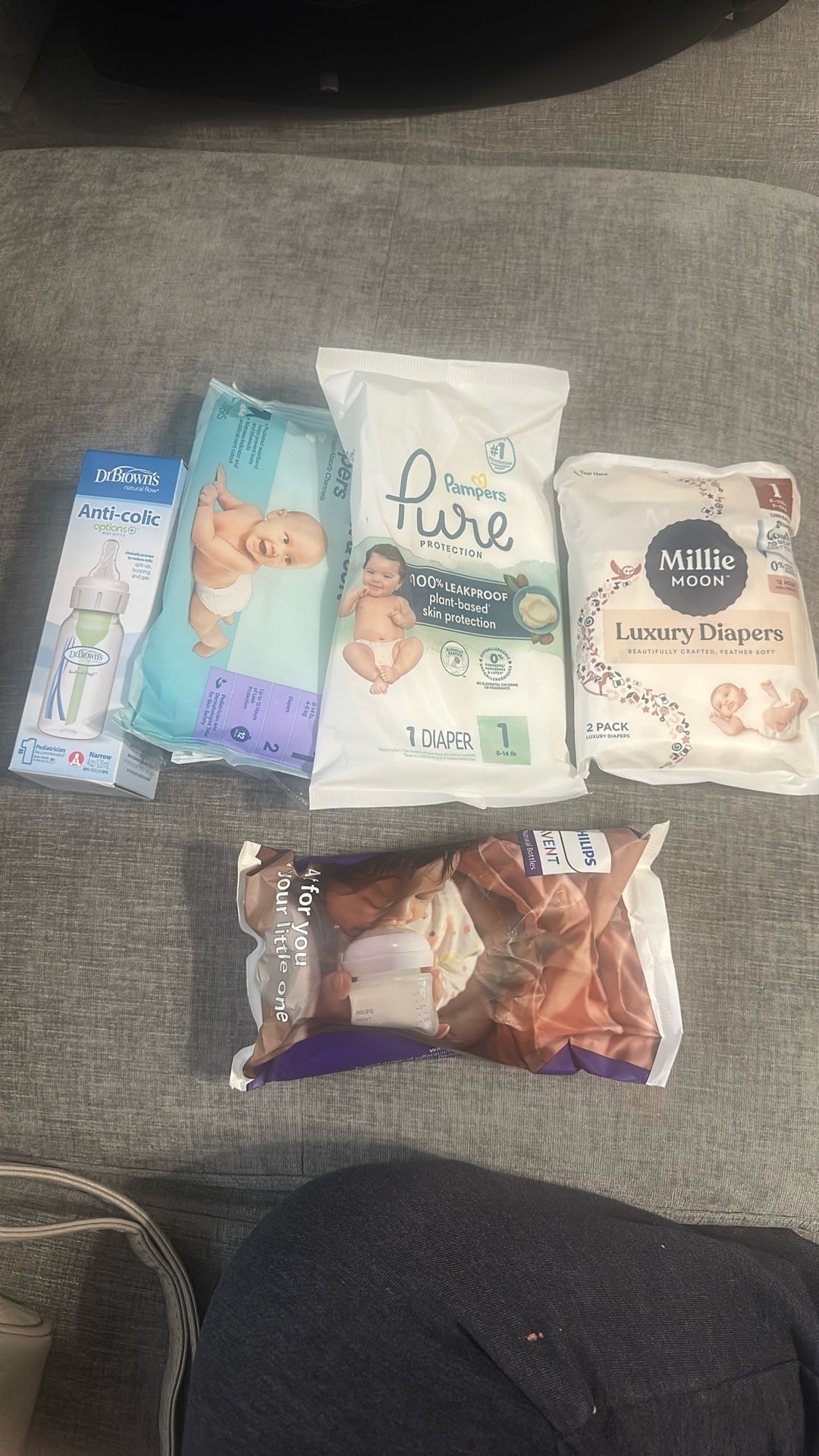 Baby Diapers And 2 Bottles