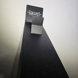 Motorcycle helmet wall hanger