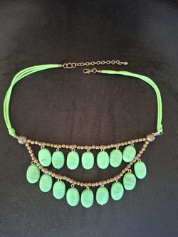 Vibrant green necklace with two tiers of oval-shaped beads.