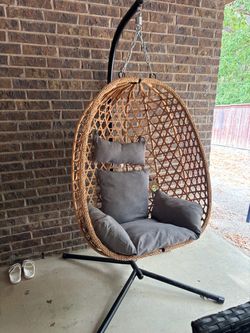 Egg chair with stand and cushions