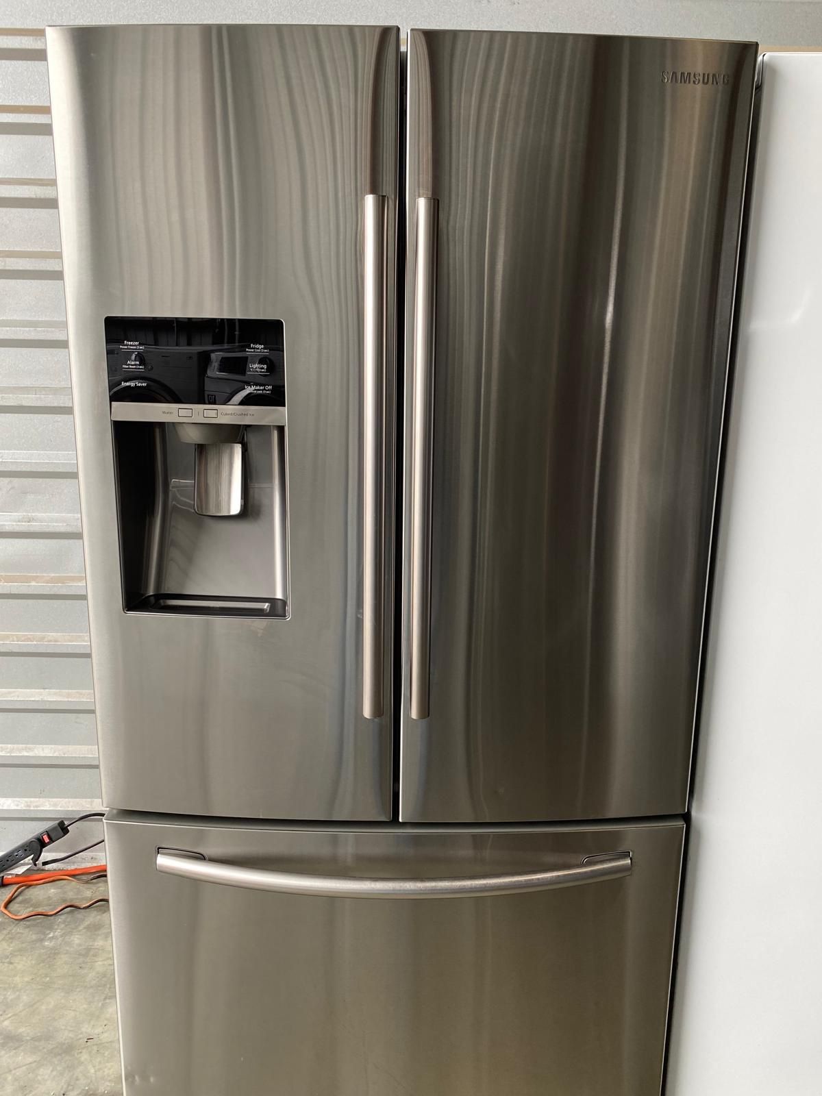 Samsung refrigerator french door stainless with water and ice dispenser dimensions 68 7/8 height 35 7/8 width 32 depth in excellent working condition