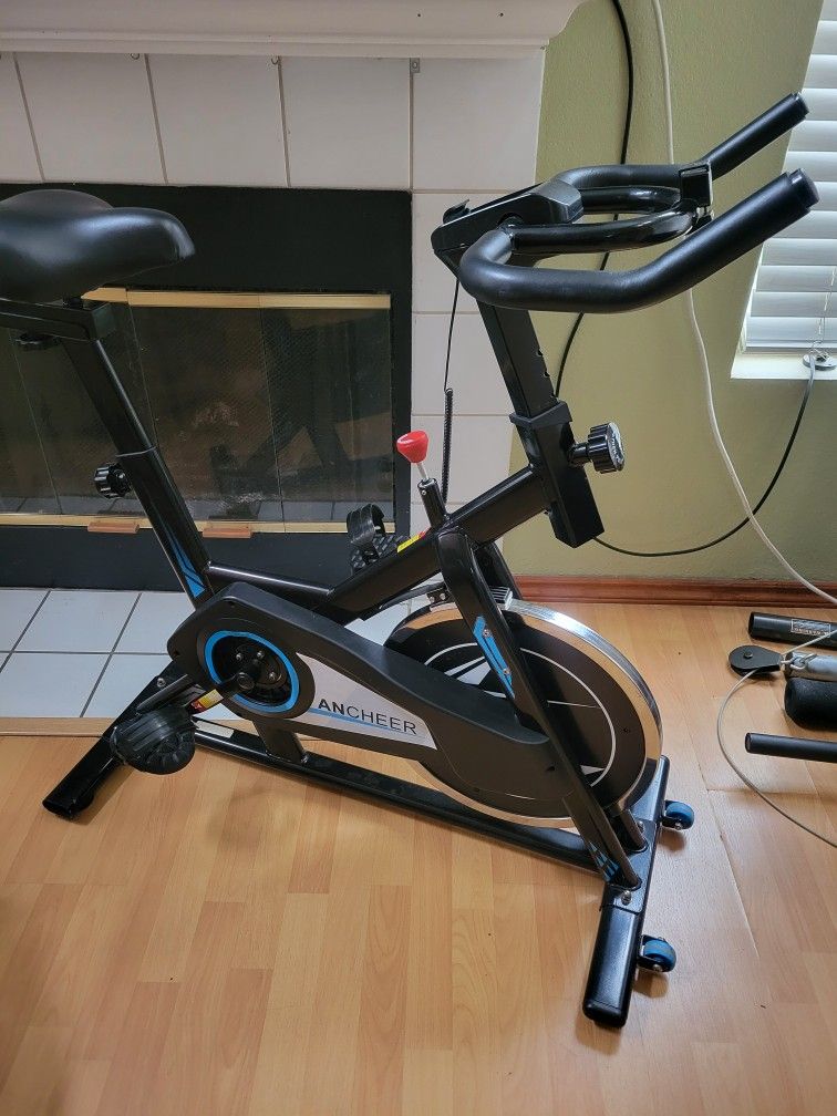 ANCHEER Indoor Exercise Bike Stationary, Indoor Cycling Bike with Comfortable Seat Cushion, Tablet Holder and LCD Monitor for Home Workout, 40 LBS Fly