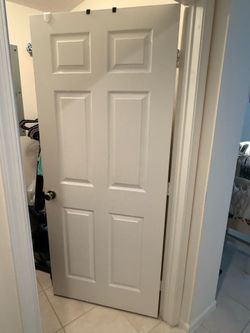 Door with knob and hardware hinges